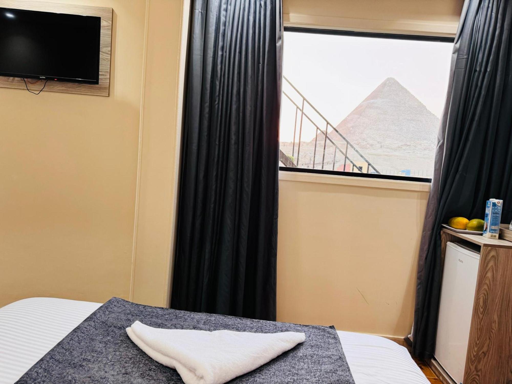 Hotel New Scarab Pyramids View à Kafret el-Gabal Extérieur photo